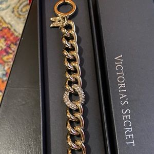 Vintage, NEW in box. Victoria Secret goldstone angel wing toggle.